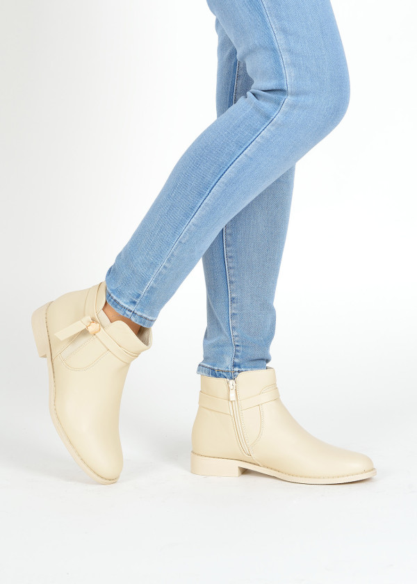 Beige strap detailed ankle boots 1