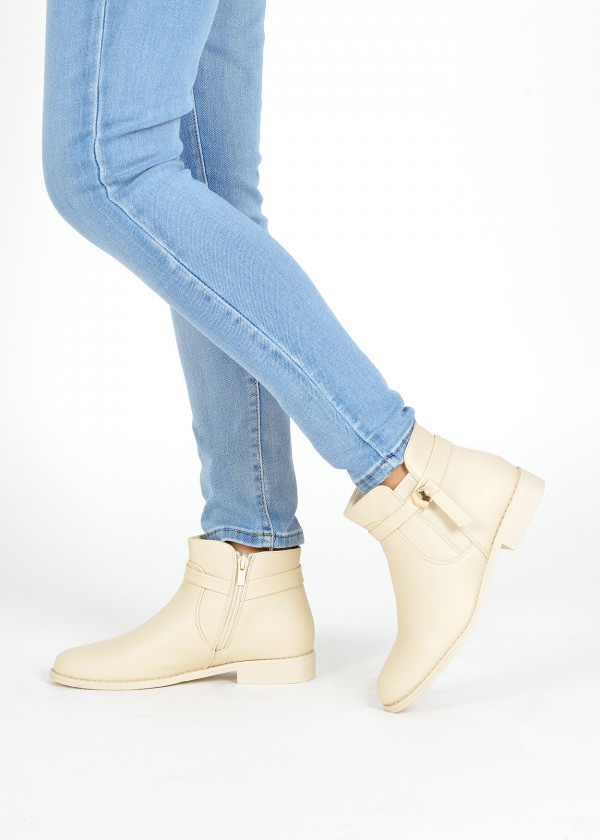 Beige strap detailed ankle boots