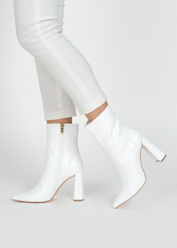 White pointed toe heeled midi boots