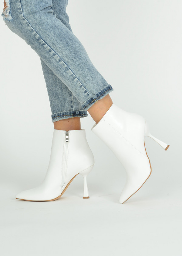 White pointed toe heeled ankle boots