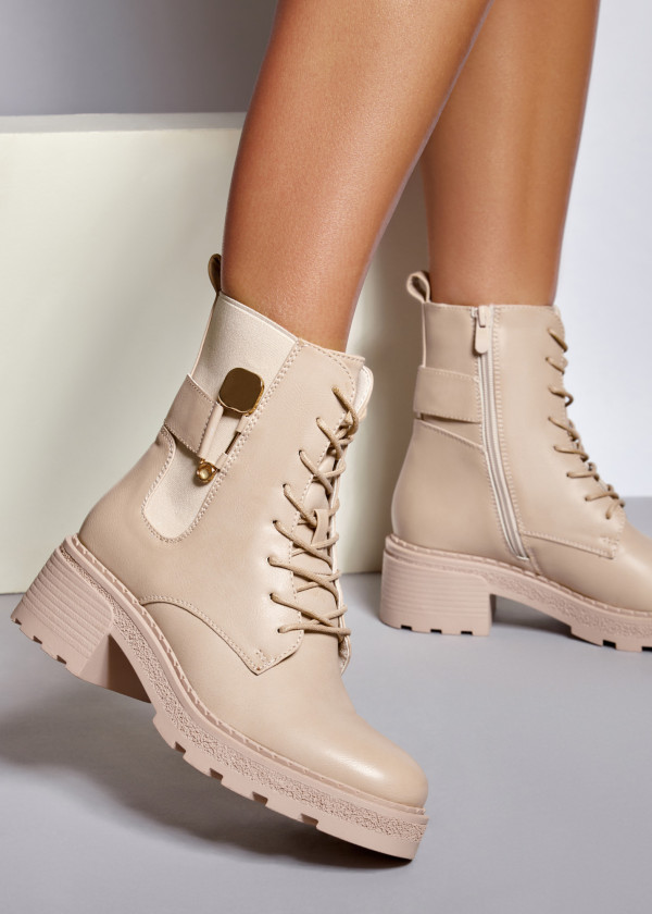 Beige safety pin detailed ankle boots