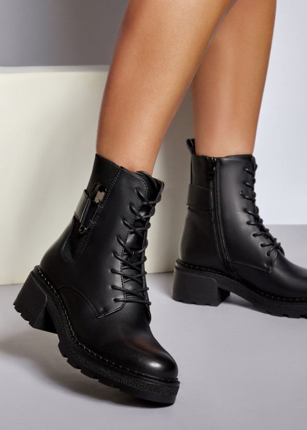Black safety pin detailed ankle boots