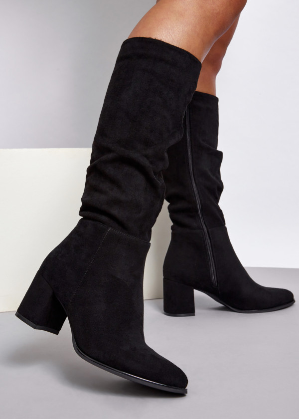 Black slouched heeled knee high boots 1