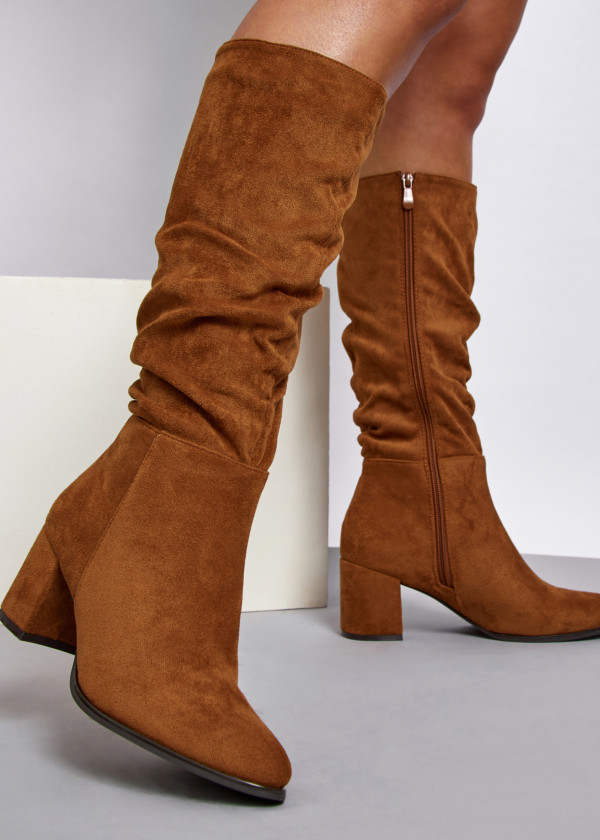 Tan slouched heeled knee high boots