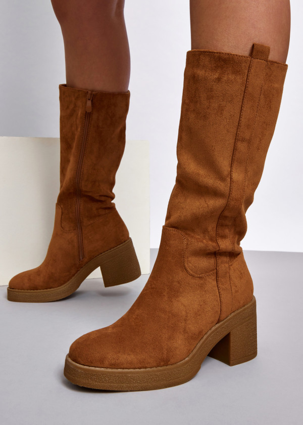 Tan heeled knee high boots