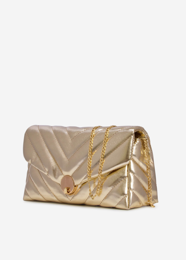 Gold quilted puffer clutch bag 1
