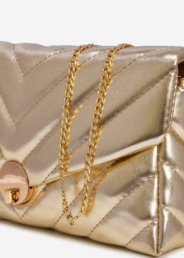 Gold quilted puffer clutch bag 3