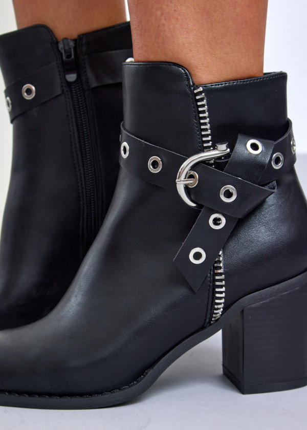 Black block heel ankle boots with grommet strap 1