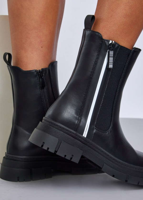 Black chunky sole boots with reflective detail 1