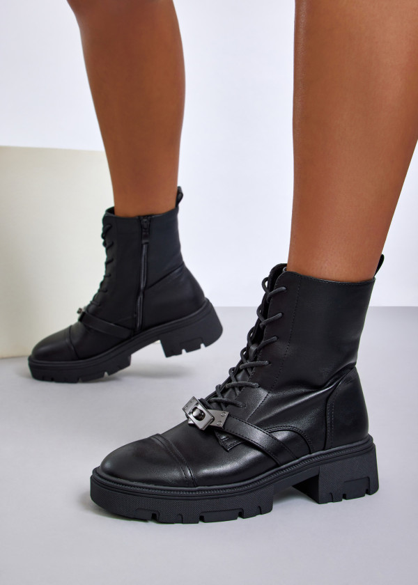 Black lace-up combat boots with front buckle detail