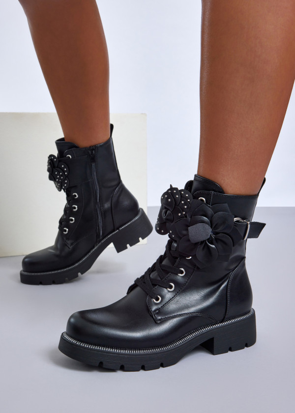 Black combat boots with floral feature 4