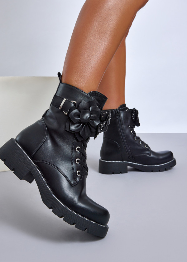 Black combat boots with floral feature 1