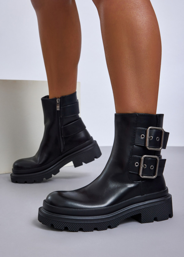 Black chunky boots with double buckle detail