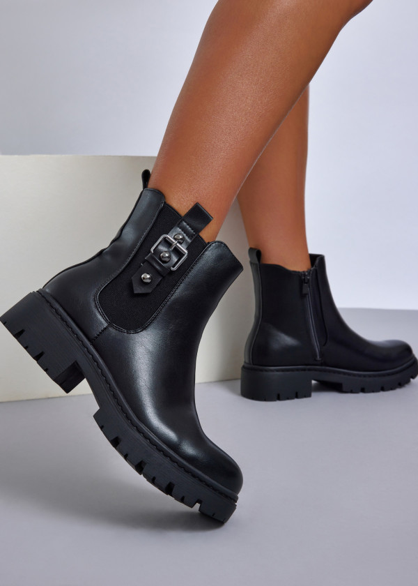 Black chelsea boots with buckle accent 1