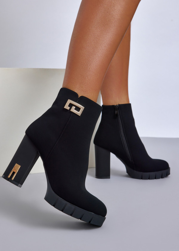 Black high heel ankle boots with gold accent 1