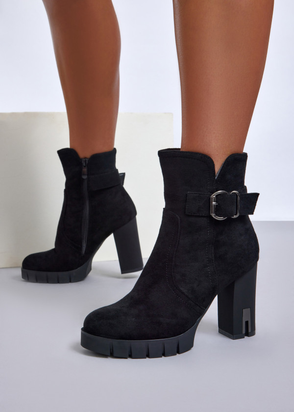 Black ankle boots with metallic buckle detail