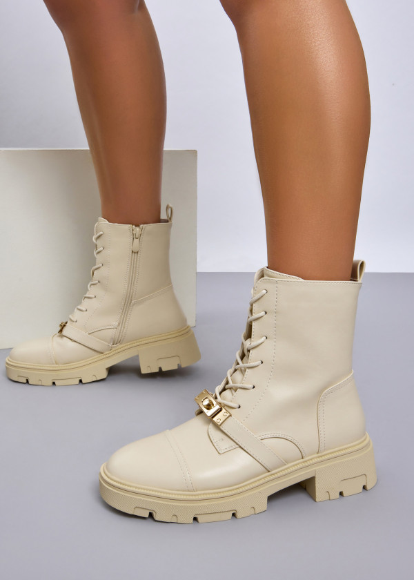 Beige lace up combat boots with front buckle detail