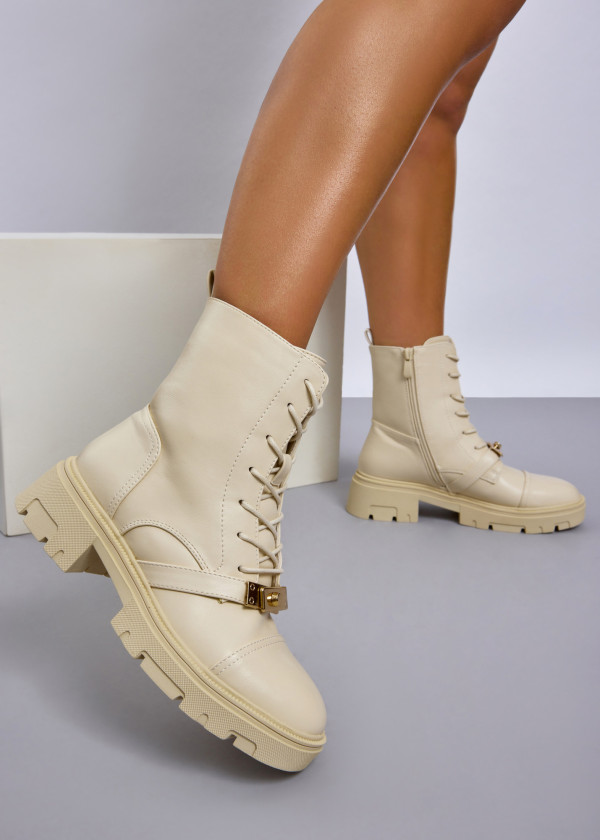 Beige lace up combat boots with front buckle detail 1